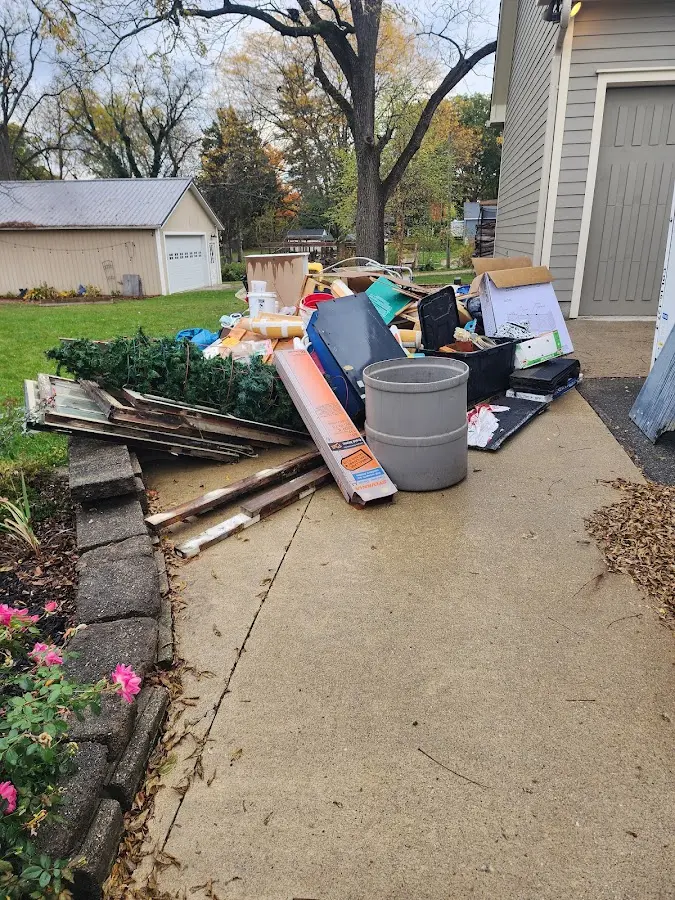 Dumpster being loaded with debris for 3 Yard Dumpster Rental in Prairie Ridge